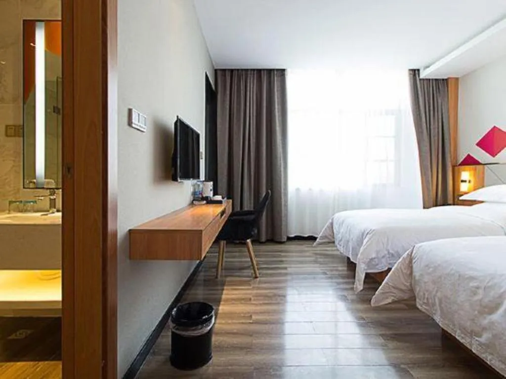 Bed in Borrman Hotel Jingzhou Jiangjin West Road Wanda Plaza Fantawild