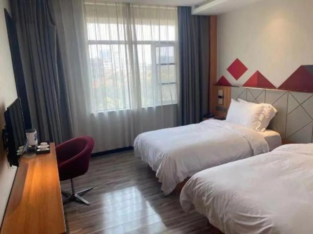 Bed in Borrman Hotel Jingzhou Jiangjin West Road Wanda Plaza Fantawild