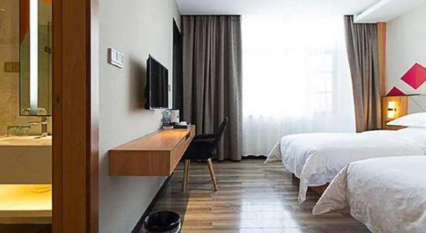 Bed in Borrman Hotel Jingzhou Jiangjin West Road Wanda Plaza Fantawild