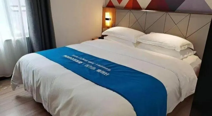 Bed in Borrman Hotel Jingzhou Jiangjin West Road Wanda Plaza Fantawild
