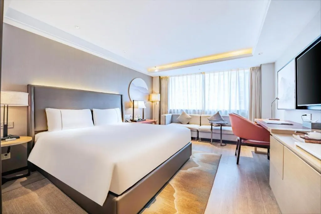 Bed in Echeng Hotel Changsha Evening News