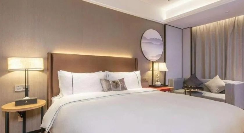 Bed in Echeng Hotel Changsha Evening News