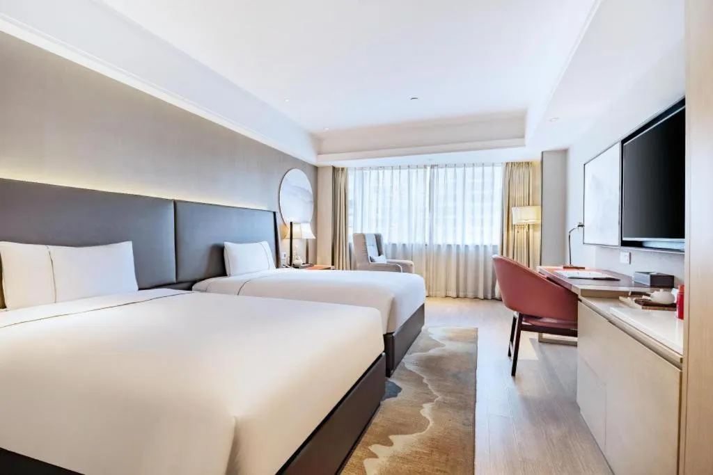 Bed in Echeng Hotel Changsha Evening News