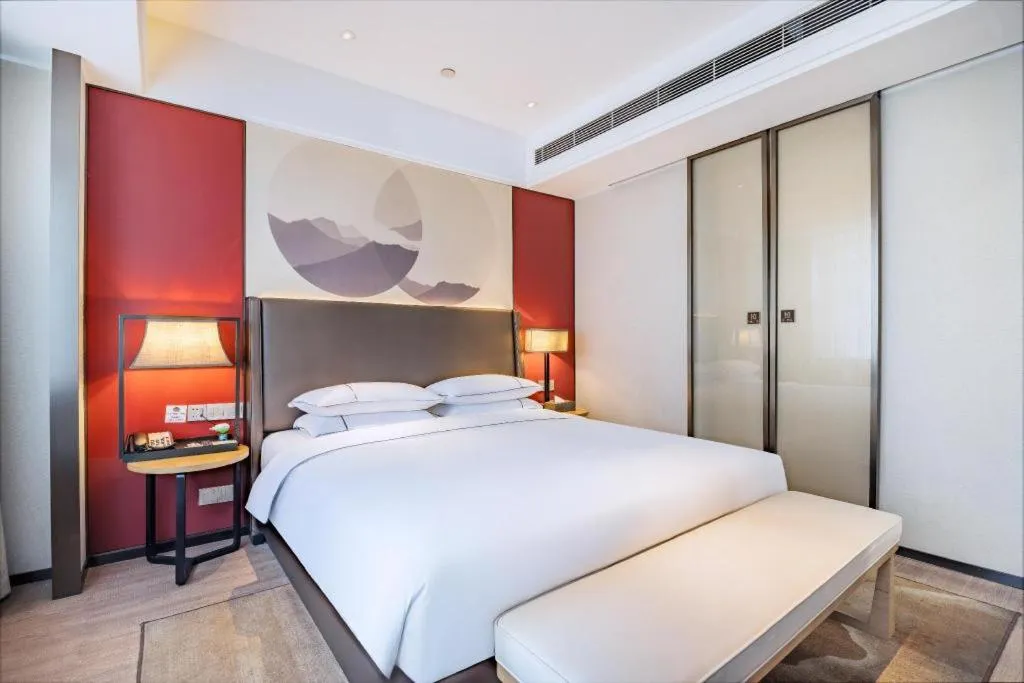 Bed in Echeng Hotel Changsha Evening News