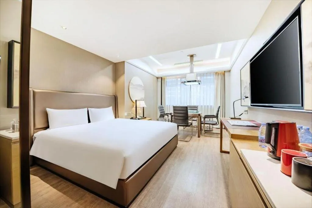 Bed in Echeng Hotel Changsha Evening News