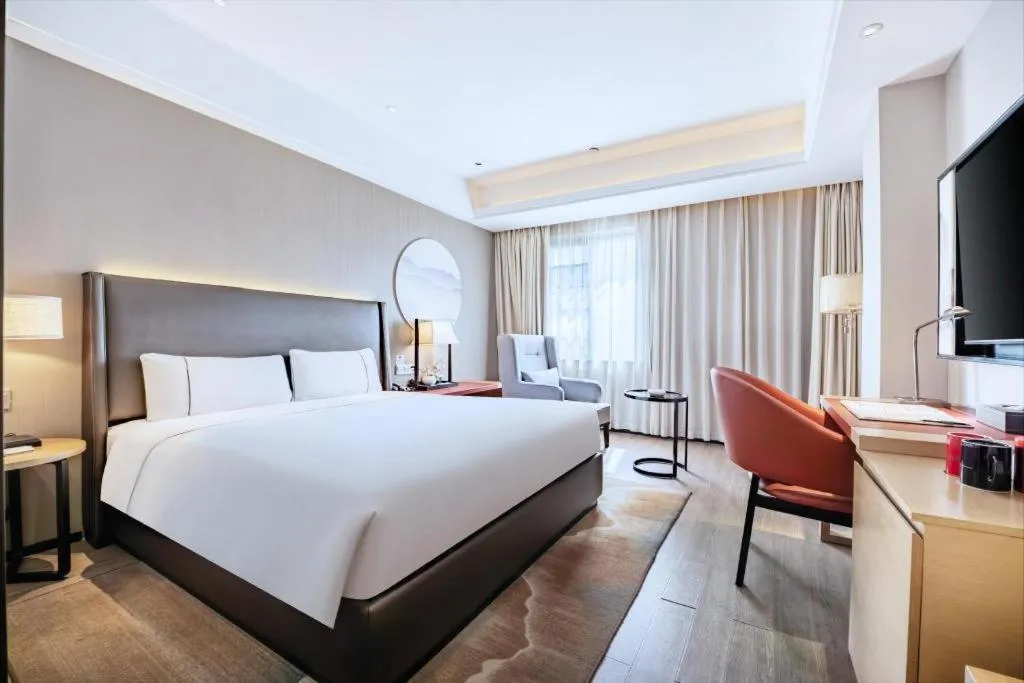 Bed in Echeng Hotel Changsha Evening News