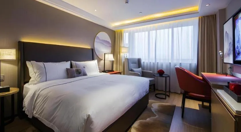 Bed in Echeng Hotel Changsha Evening News