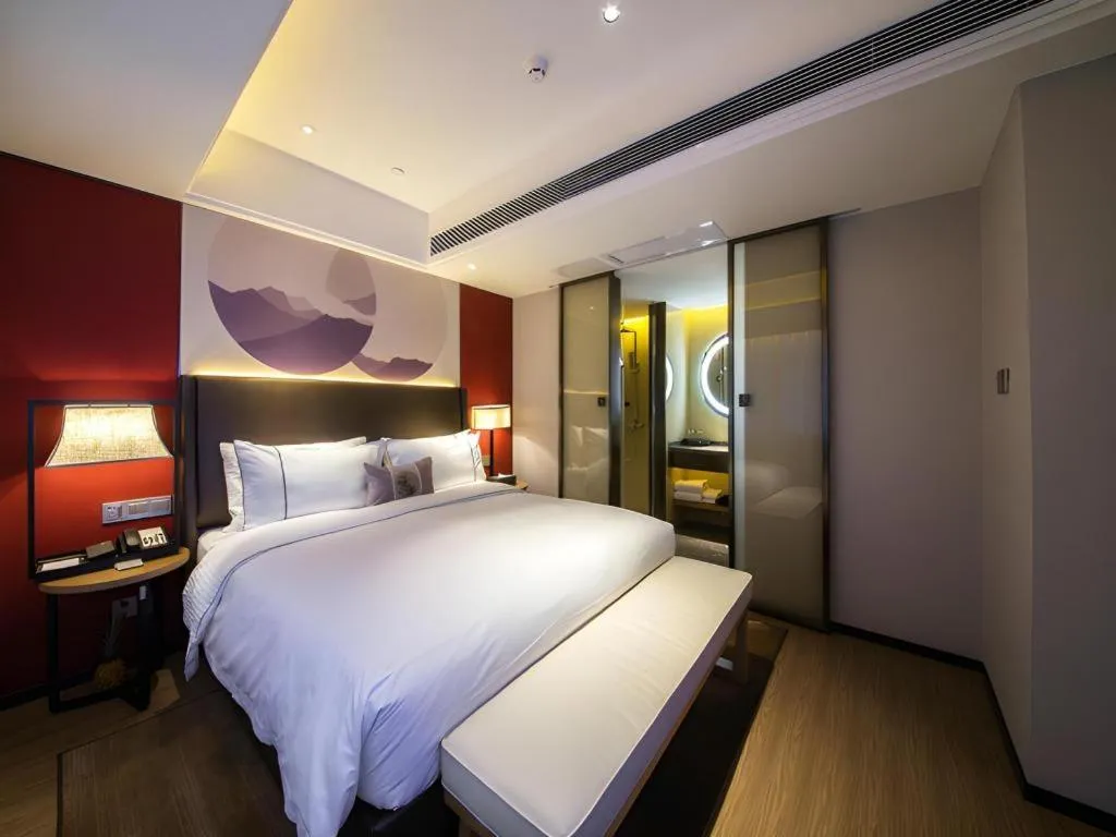 Bed in Echeng Hotel Changsha Evening News