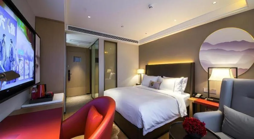 Bed in Echeng Hotel Changsha Evening News