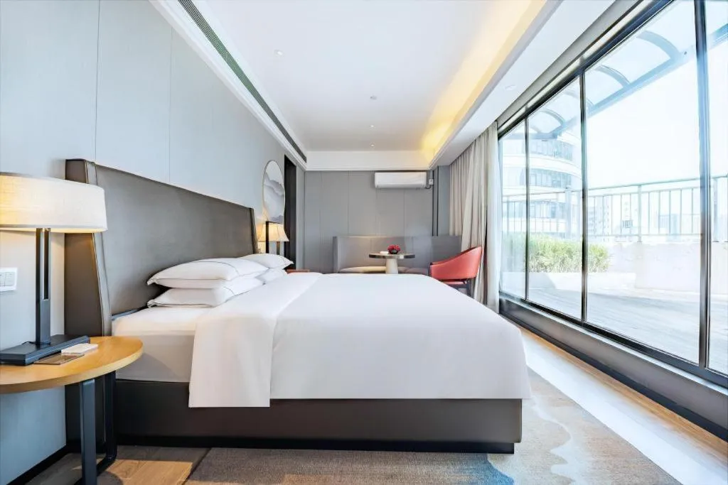 Bed in Echeng Hotel Changsha Evening News