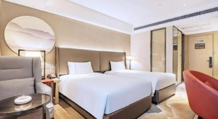 Bed in Echeng Hotel Changsha Evening News