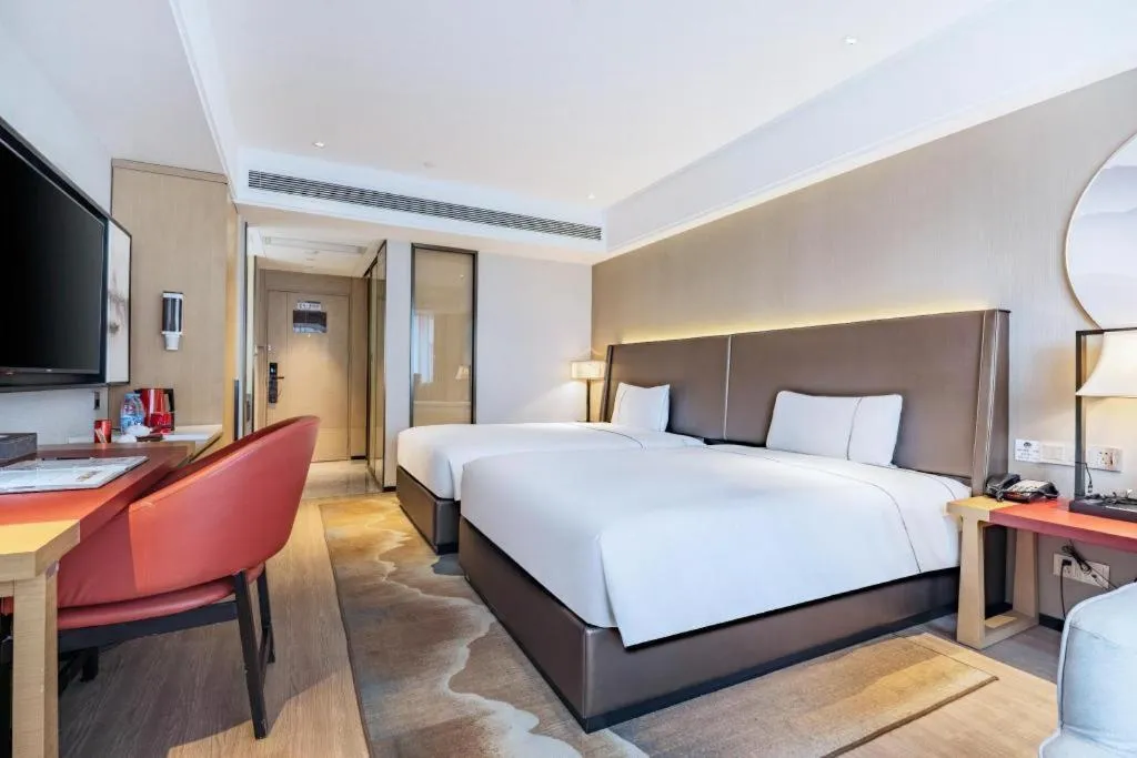 Bed in Echeng Hotel Changsha Evening News