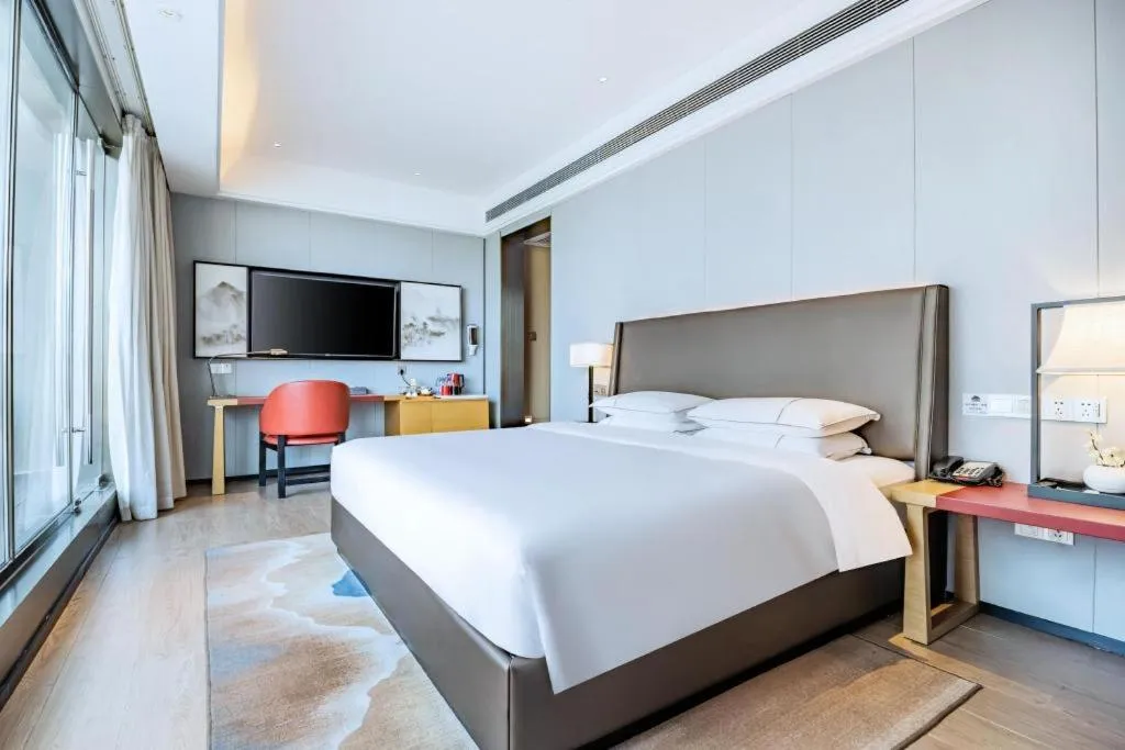 Bed in Echeng Hotel Changsha Evening News