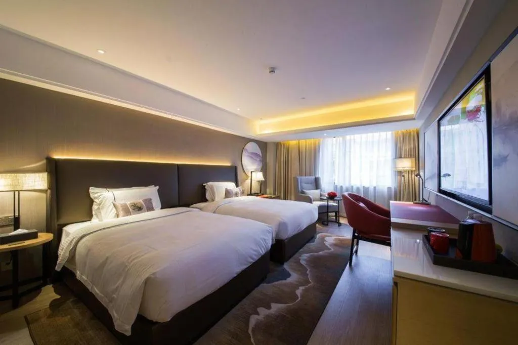 Bed in Echeng Hotel Changsha Evening News