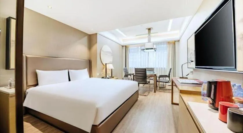 Bed in Echeng Hotel Changsha Evening News