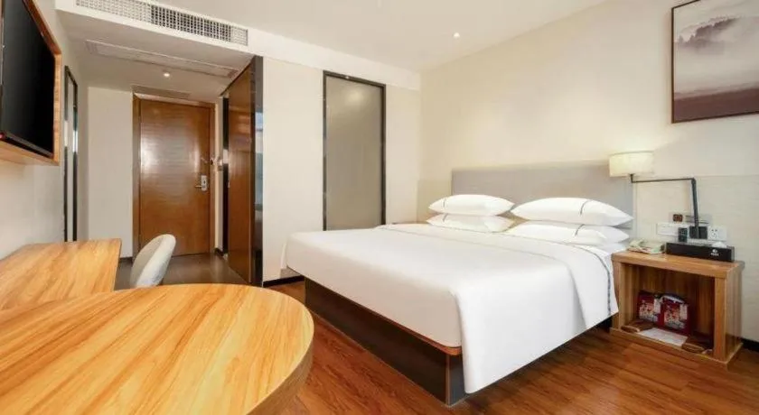 Bed in JTOUR Inn Hechi Yizhou Municipal Central Plaza