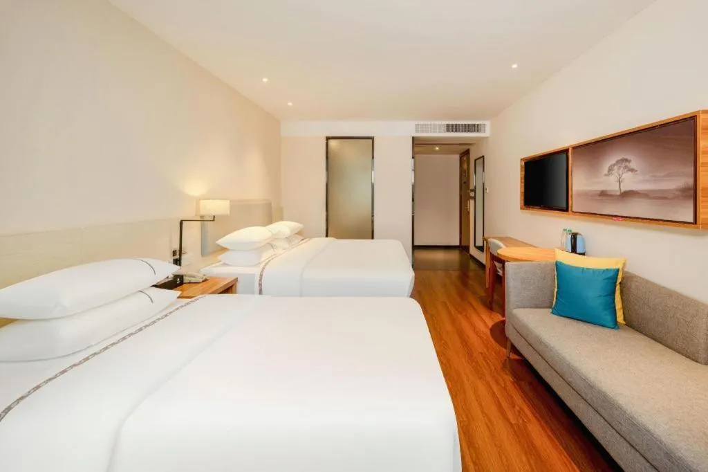 Bed in JTOUR Inn Hechi Yizhou Municipal Central Plaza