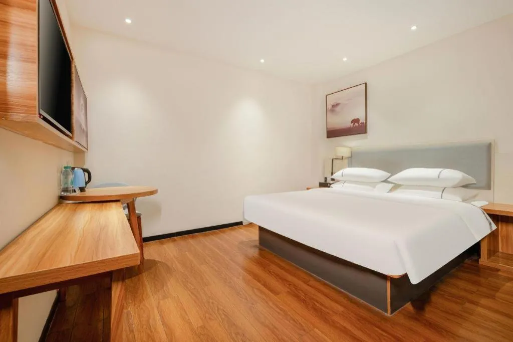 Bed in JTOUR Inn Hechi Yizhou Municipal Central Plaza