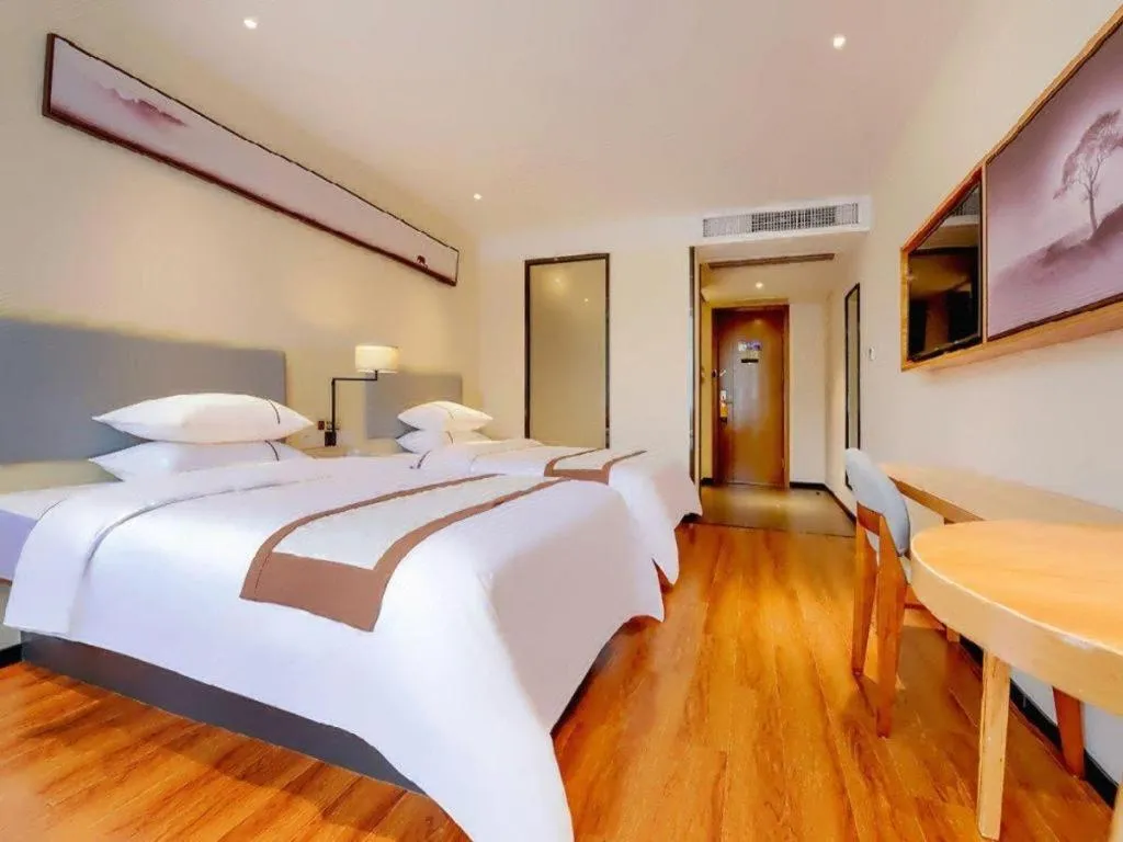 Bed in JTOUR Inn Hechi Yizhou Municipal Central Plaza