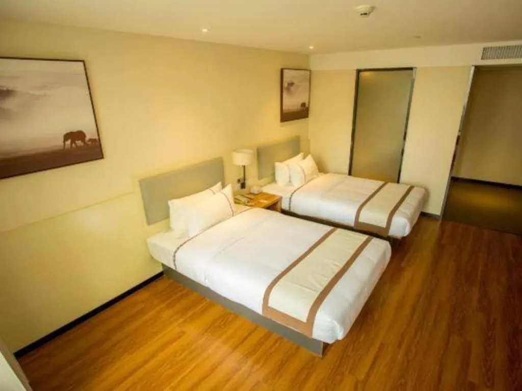 Bed in JTOUR Inn Hechi Yizhou Municipal Central Plaza