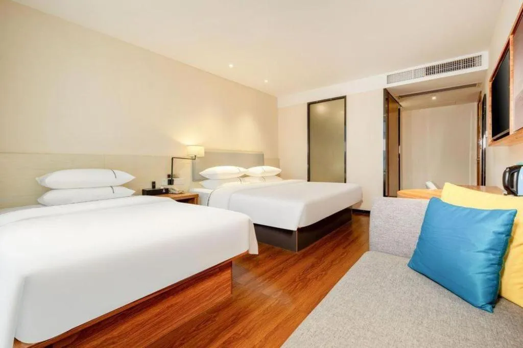 Bed in JTOUR Inn Hechi Yizhou Municipal Central Plaza