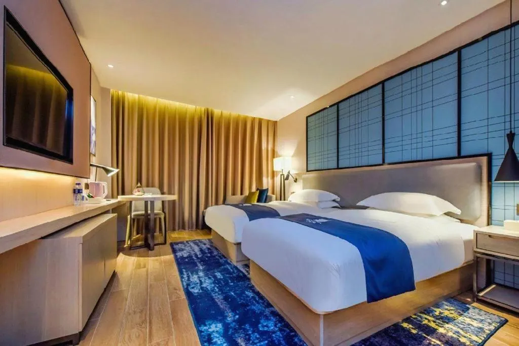 Bed in Echarm Hotel Anshun High-speed Railway Station Jichang Road