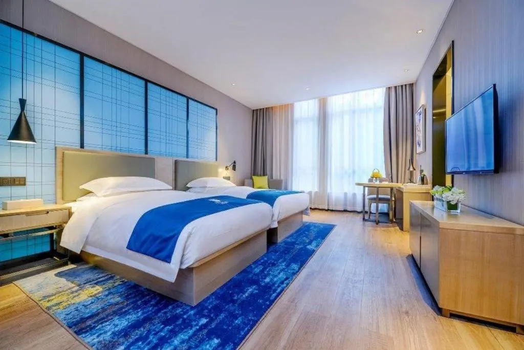 Bed in Echarm Hotel Anshun High-speed Railway Station Jichang Road