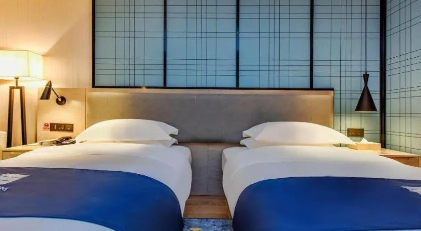 Bed in Echarm Hotel Anshun High-speed Railway Station Jichang Road