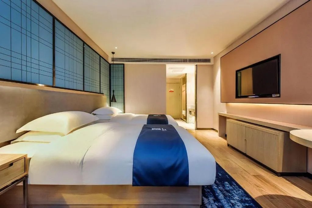 Bed in Echarm Hotel Anshun High-speed Railway Station Jichang Road