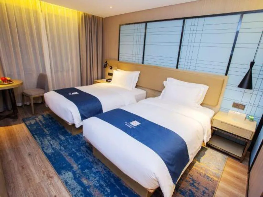 Bed in Echarm Hotel Nanning Guangxi University Xinyang Longteng District Maternal and Child Hospital