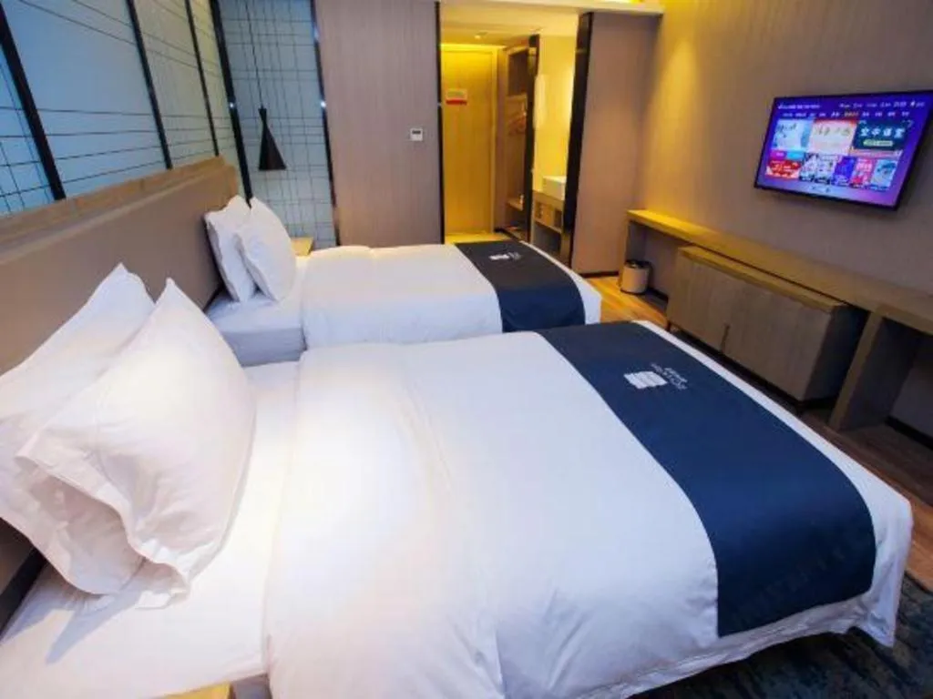 Bed in Echarm Hotel Nanning Guangxi University Xinyang Longteng District Maternal and Child Hospital