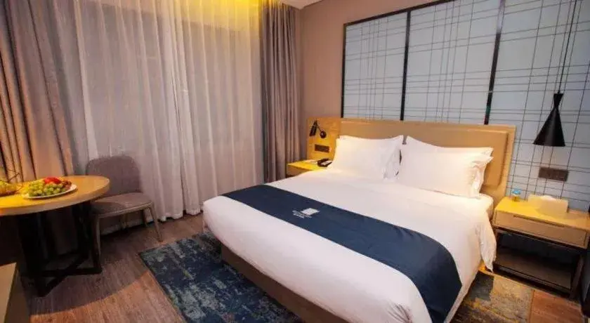 Bed in Echarm Hotel Nanning Guangxi University Xinyang Longteng District Maternal and Child Hospital Bed in Echarm Hotel Nanning Guangxi University Xinyang Longteng District Maternal and Child Hospital