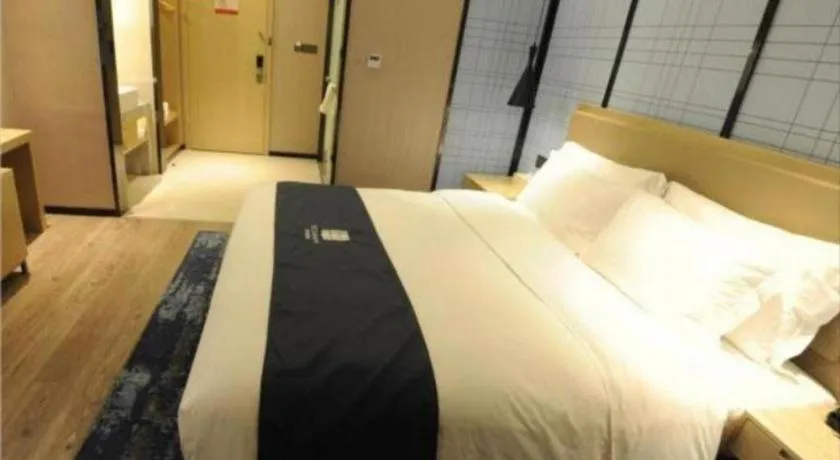 Bed in Echarm Hotel Nanning Guangxi University Xinyang Longteng District Maternal and Child Hospital