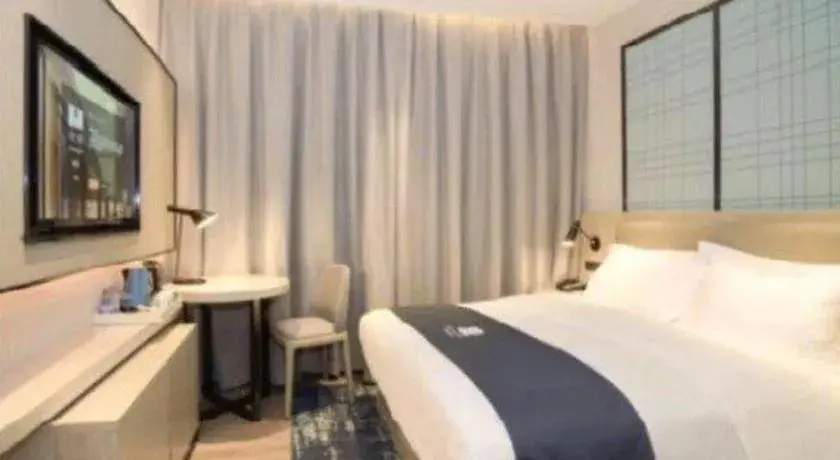 Bed in Echarm Hotel Nanning Guangxi University Xinyang Longteng District Maternal and Child Hospital Bed in Echarm Hotel Nanning Guangxi University Xinyang Longteng District Maternal and Child Hospital