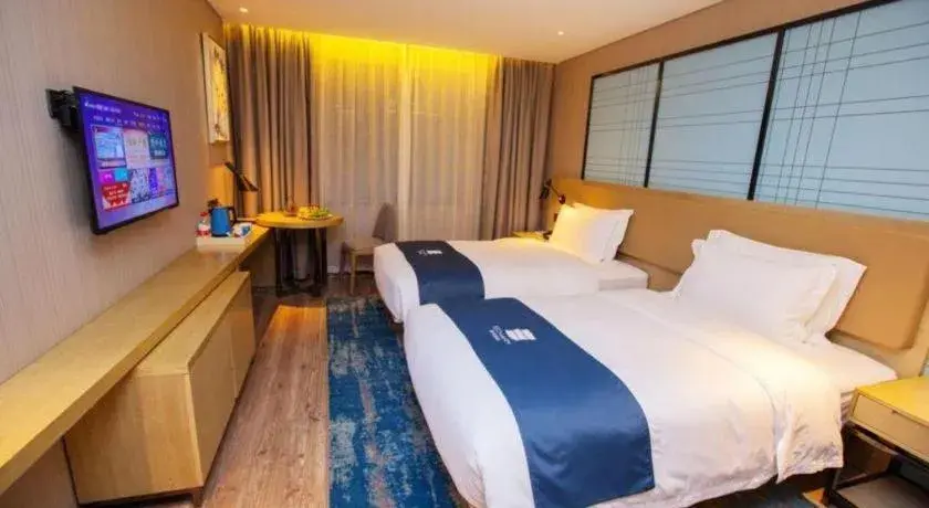 Bed in Echarm Hotel Nanning Guangxi University Xinyang Longteng District Maternal and Child Hospital Bed in Echarm Hotel Nanning Guangxi University Xinyang Longteng District Maternal and Child Hospital