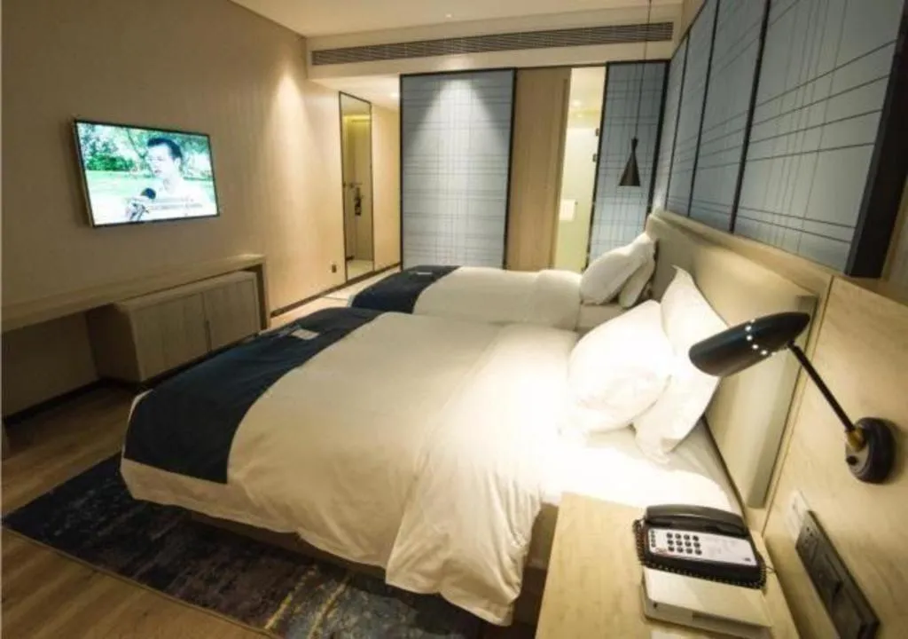 Bed in Echarm Hotel Nanning Guangxi University Xinyang Longteng District Maternal and Child Hospital