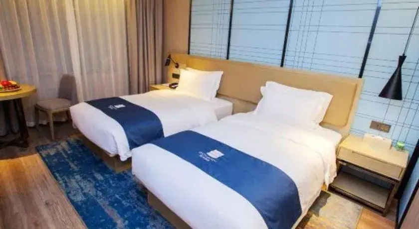Bed in Echarm Hotel Nanning Guangxi University Xinyang Longteng District Maternal and Child Hospital Bed in Echarm Hotel Nanning Guangxi University Xinyang Longteng District Maternal and Child Hospital