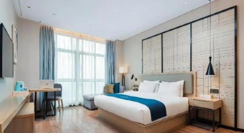 Bed in Echarm Hotel Liuzhou Liunan Wanda Plaza