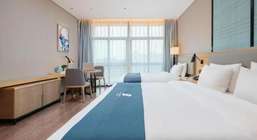Bed in Echarm Hotel Liuzhou Liunan Wanda Plaza