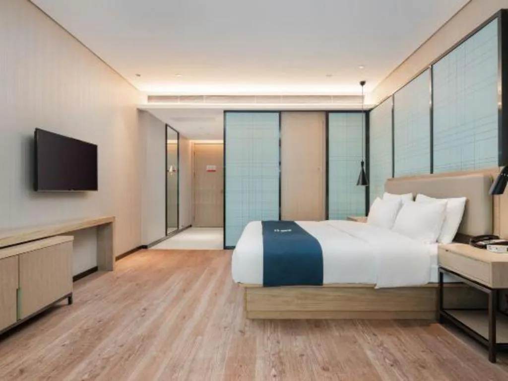 Bed in Echarm Hotel Liuzhou Liunan Wanda Plaza