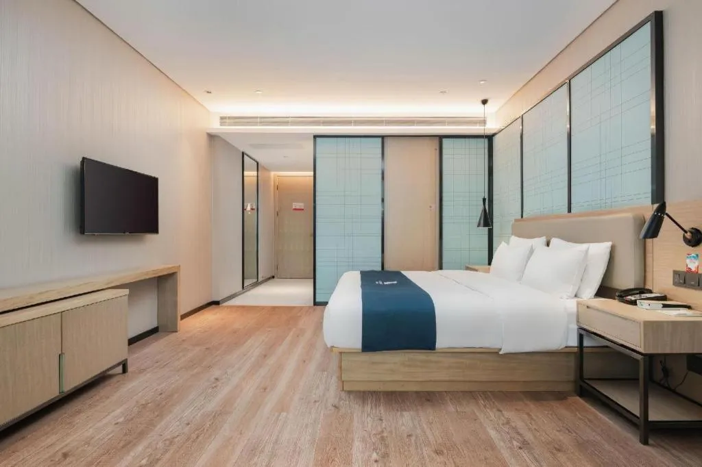 Bed in Echarm Hotel Liuzhou Liunan Wanda Plaza