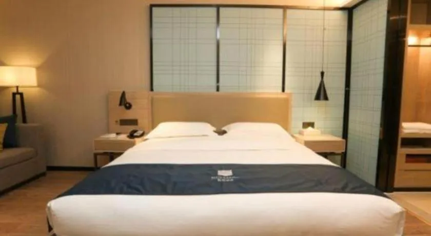 Bed in Echarm Hotel Liuzhou Liunan Wanda Plaza