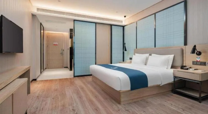 Bed in Echarm Hotel Liuzhou Liunan Wanda Plaza