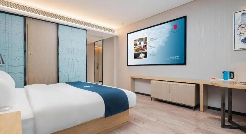 Bed in Echarm Hotel Liuzhou Liunan Wanda Plaza