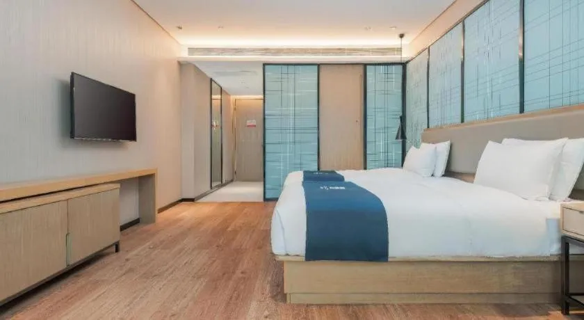 Bed in Echarm Hotel Liuzhou Liunan Wanda Plaza