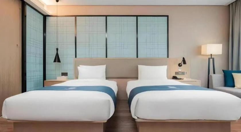 Bed in Echarm Hotel Liuzhou Liunan Wanda Plaza