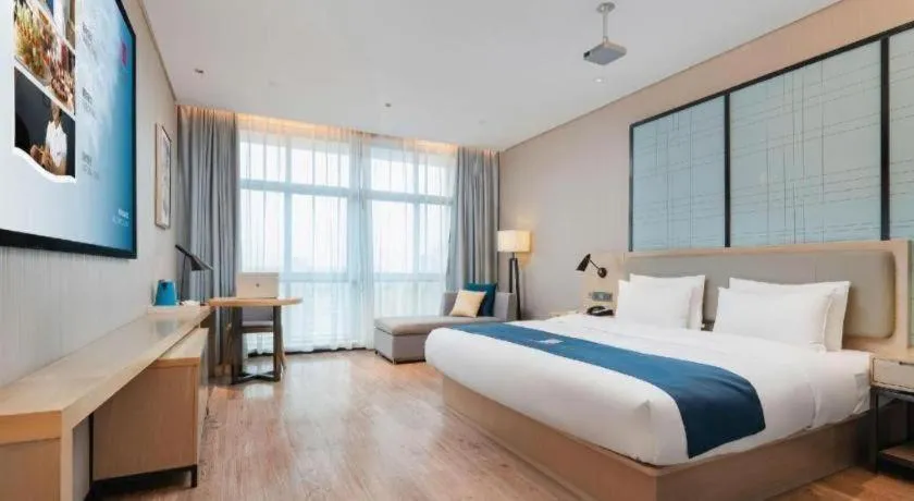 Bed in Echarm Hotel Liuzhou Liunan Wanda Plaza