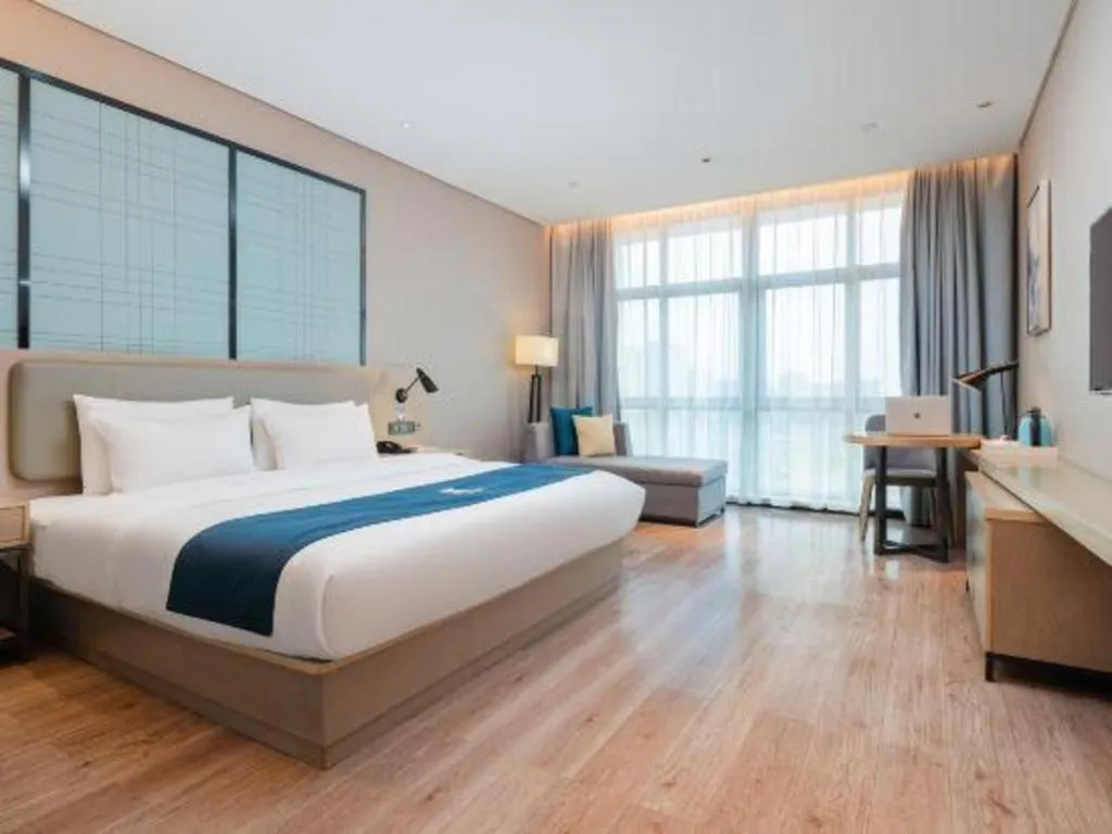 Bed in Echarm Hotel Liuzhou Liunan Wanda Plaza