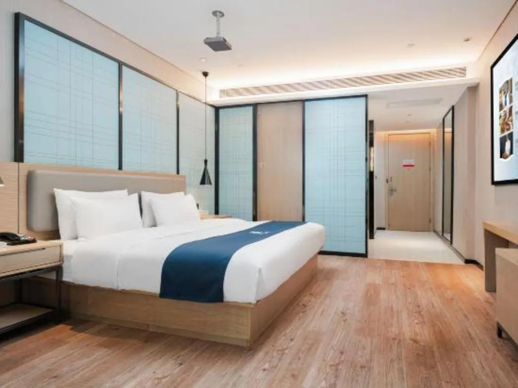 Bed in Echarm Hotel Liuzhou Liunan Wanda Plaza
