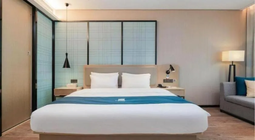 Bed in Echarm Hotel Liuzhou Liunan Wanda Plaza